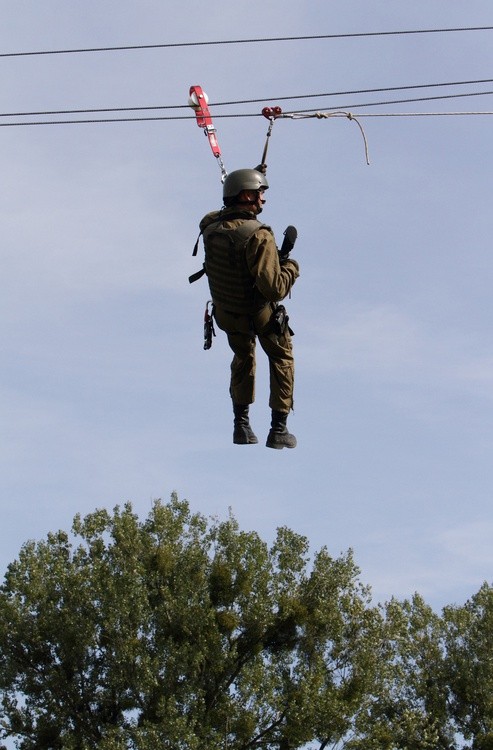 A person in a parachute jump AI-generated content may be incorrect.