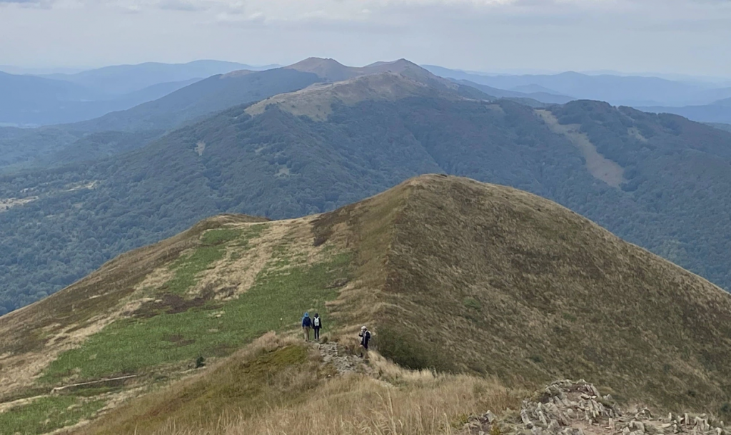 People walking on a mountain AI-generated content may be incorrect.
