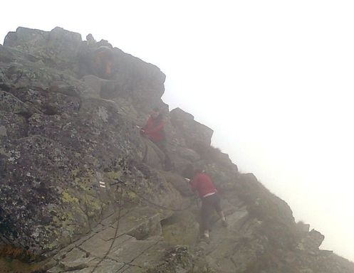 a-group-of-people-climbing-a-mountain-ai-generate A group of people climbing a mountain AI-generated content may be incorrect.