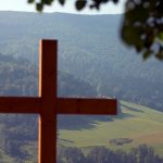 A cross on a hill AI-generated content may be incorrect.