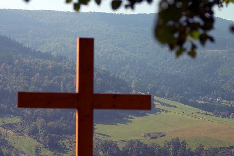 A cross on a hill AI-generated content may be incorrect.