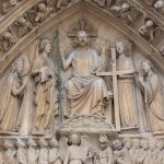 A statue of a person holding a cross AI-generated content may be incorrect.