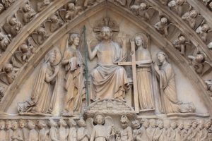 A statue of a person holding a cross AI-generated content may be incorrect.