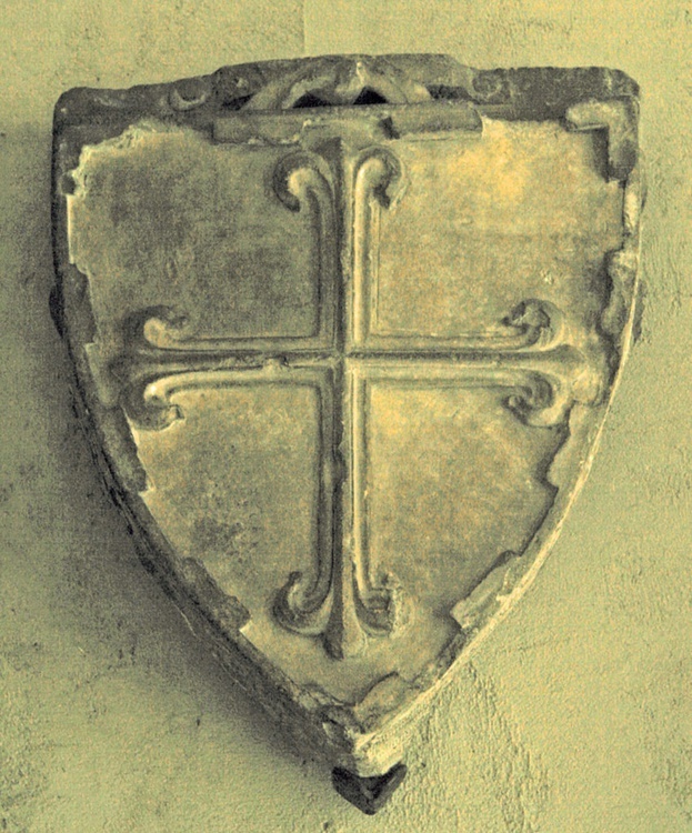 A stone shield with a cross AI-generated content may be incorrect.