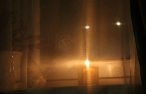 A candle in a window AI-generated content may be incorrect.