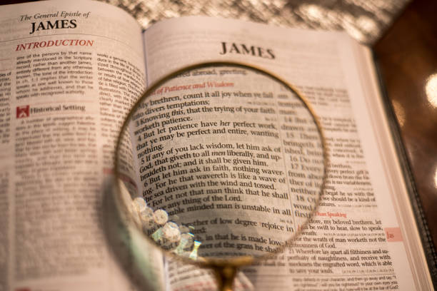 Reading the bible with magnifying glass